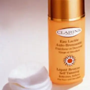 eau lactée auto bronzante, Clarin's