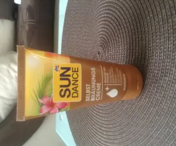 Crème autobronzante, DM