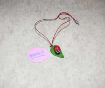 Collier coccinelle, Création