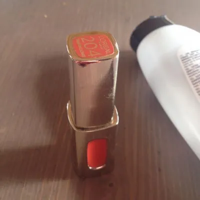 Photo 1 de gloss corail l'oréal