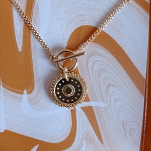 Collier pendentif doré