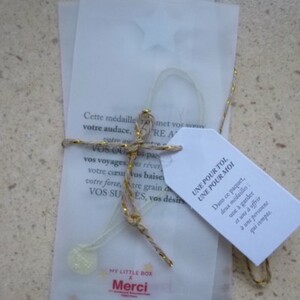 Lot de 2 pendentifs "Merci"