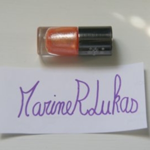 Vernis orange pailleté